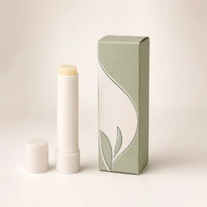 Custom lip balm box with matching product in a square studio photograph